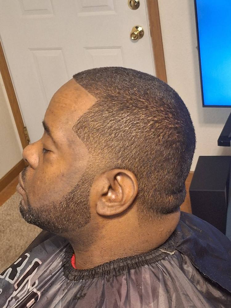 Short cut with a squared-off line-up and edged beard