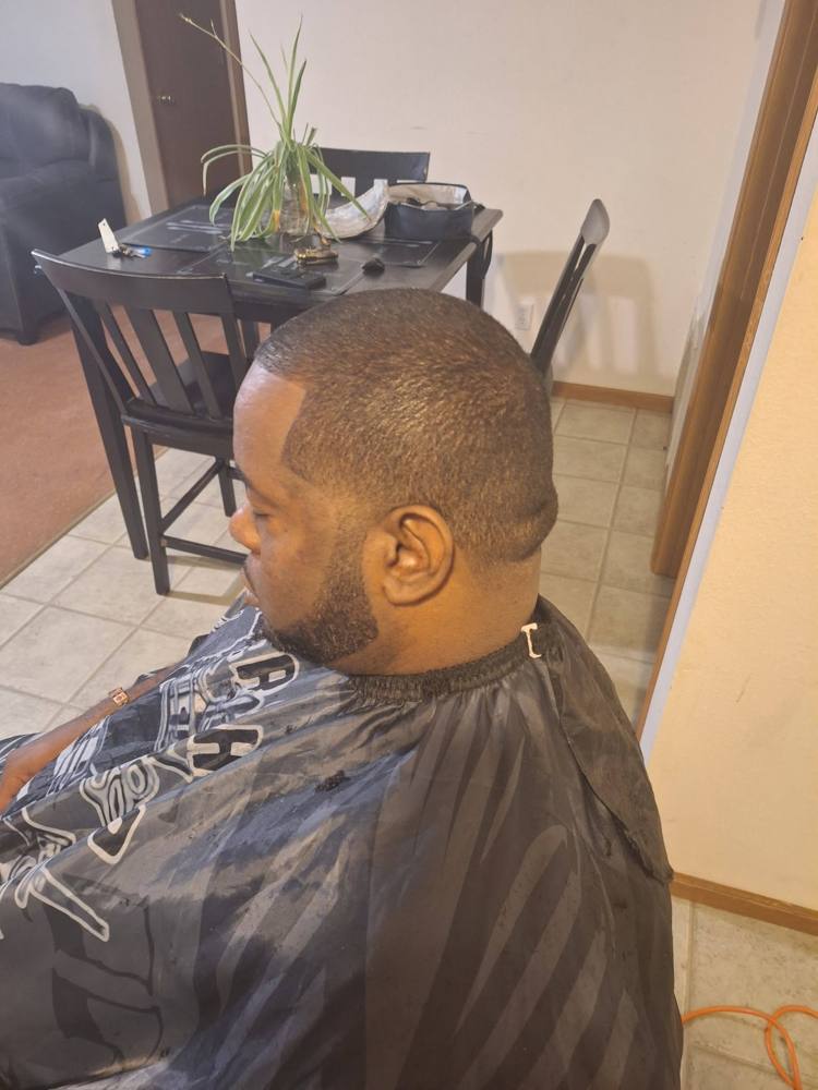 Low cut with a clean hairline and beard line