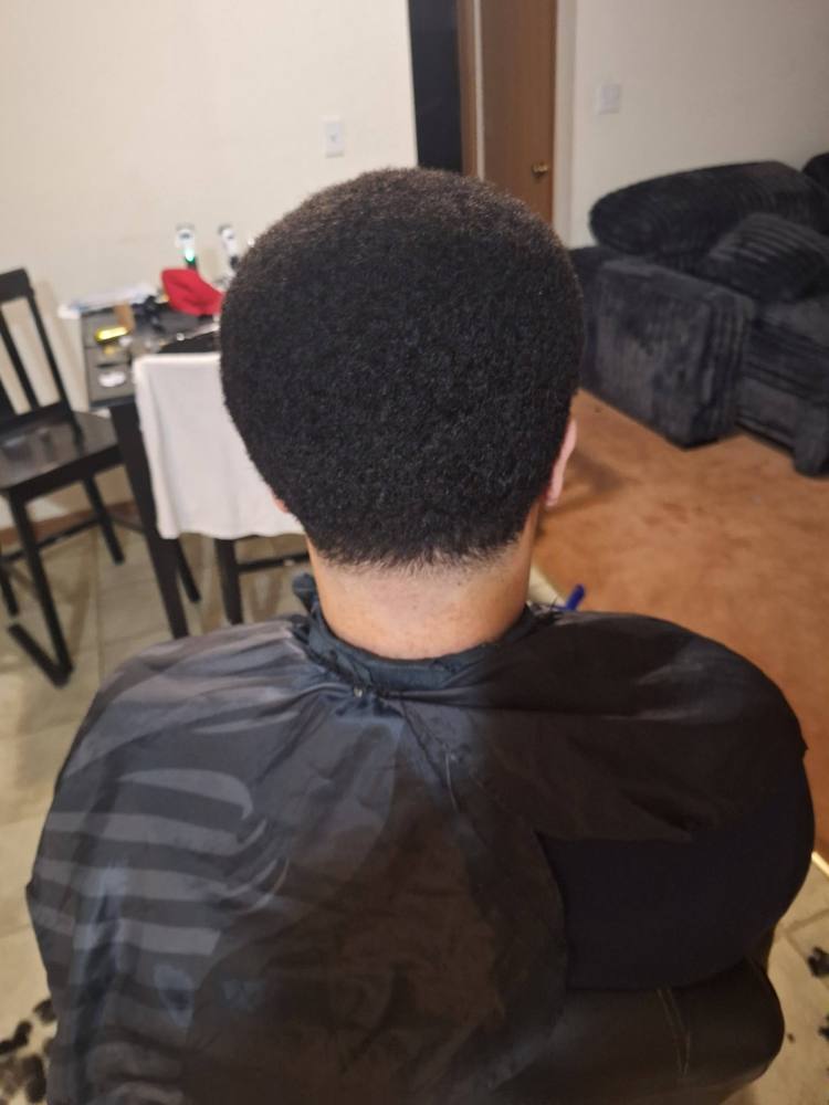 Back view of a rounded top with a tapered neckline